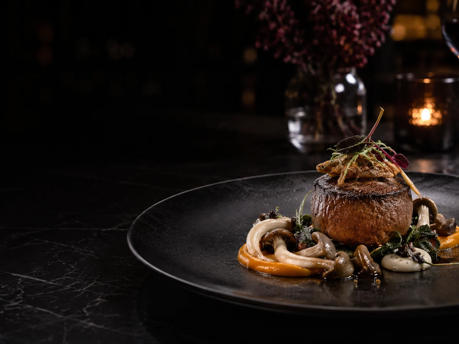 Signature course on a dark dining table